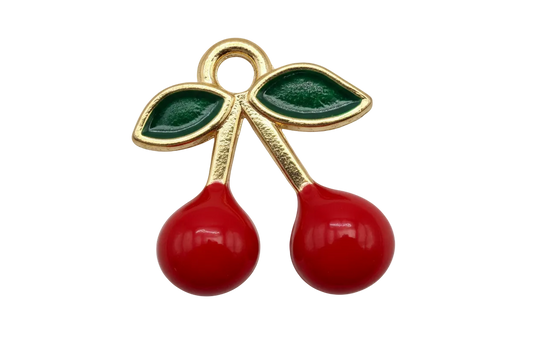 Gold cherry pair with glossy red enamel fruit and deep green leaves
