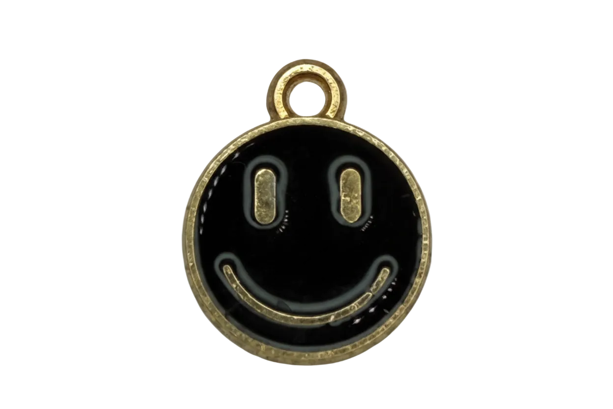 Round black enamel smiley face charm with gold trim and clear gem accent