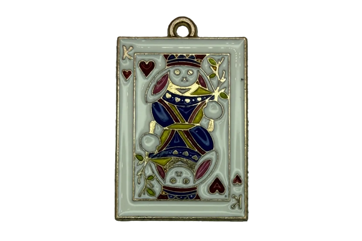 Gold-edged white enamel playing card with mirrored rabbit figure and red heart suit details