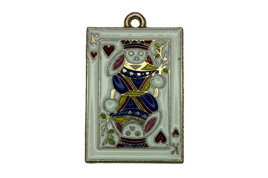 Gold-edged white enamel playing card with mirrored rabbit figure and red heart suit details