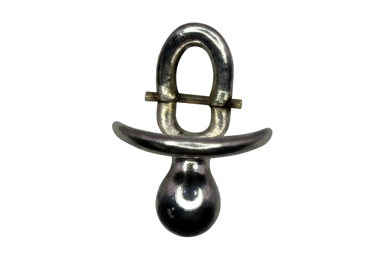 Polished silver pacifier silhouette with rounded contours on a black background