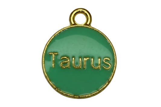Green round Taurus medallion with raised gold lettering and gold trim