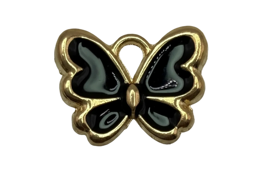 Gold butterfly charm with glossy black enamel wings and smoky gray accents