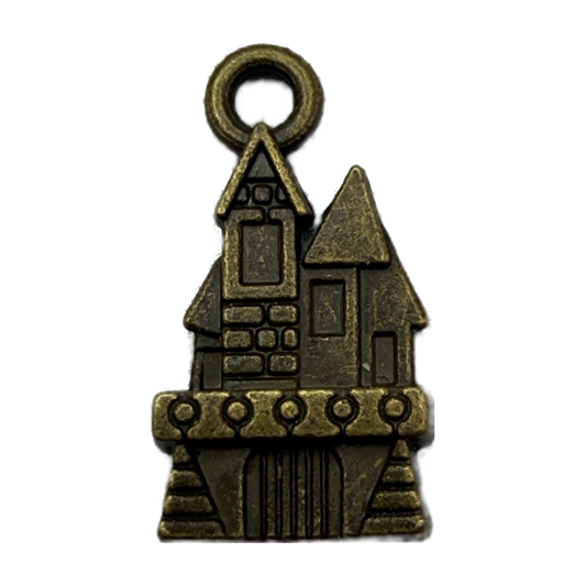 Antiqued gold castle house charm with embossed stonework and dark patina details