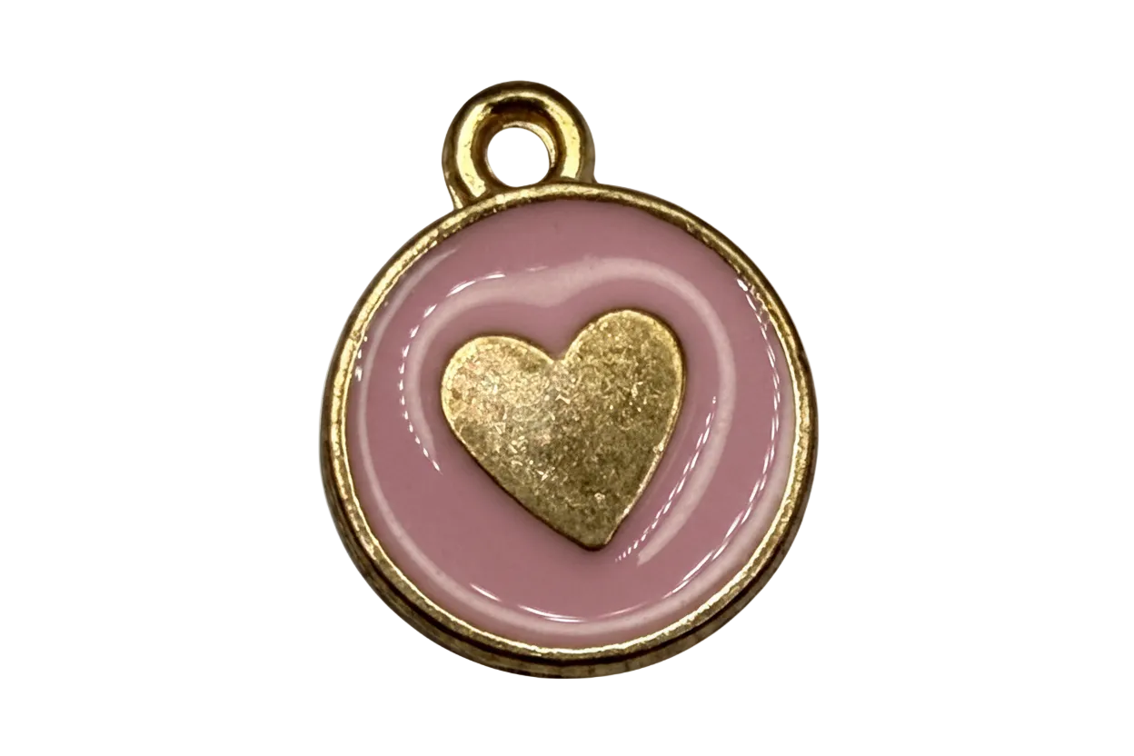 Round gold medallion charm with blush pink enamel and raised gold heart