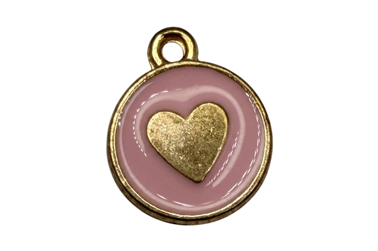 Round gold medallion charm with blush pink enamel and raised gold heart