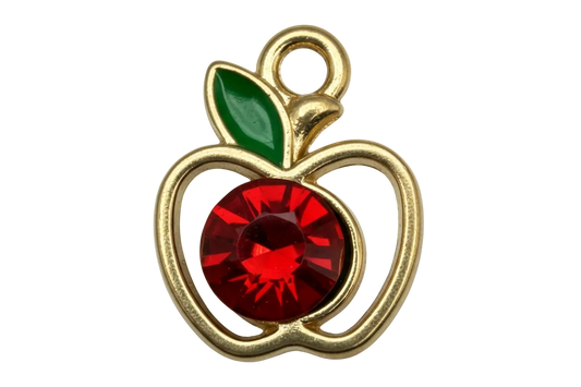 Gold apple outline charm with red faceted gem center and green enamel leaf
