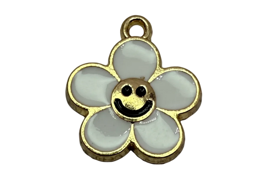 Gold-outlined white daisy with black smiley face center