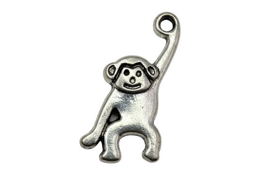 Oxidized silver-tone hanging monkey figure with raised arm and engraved face