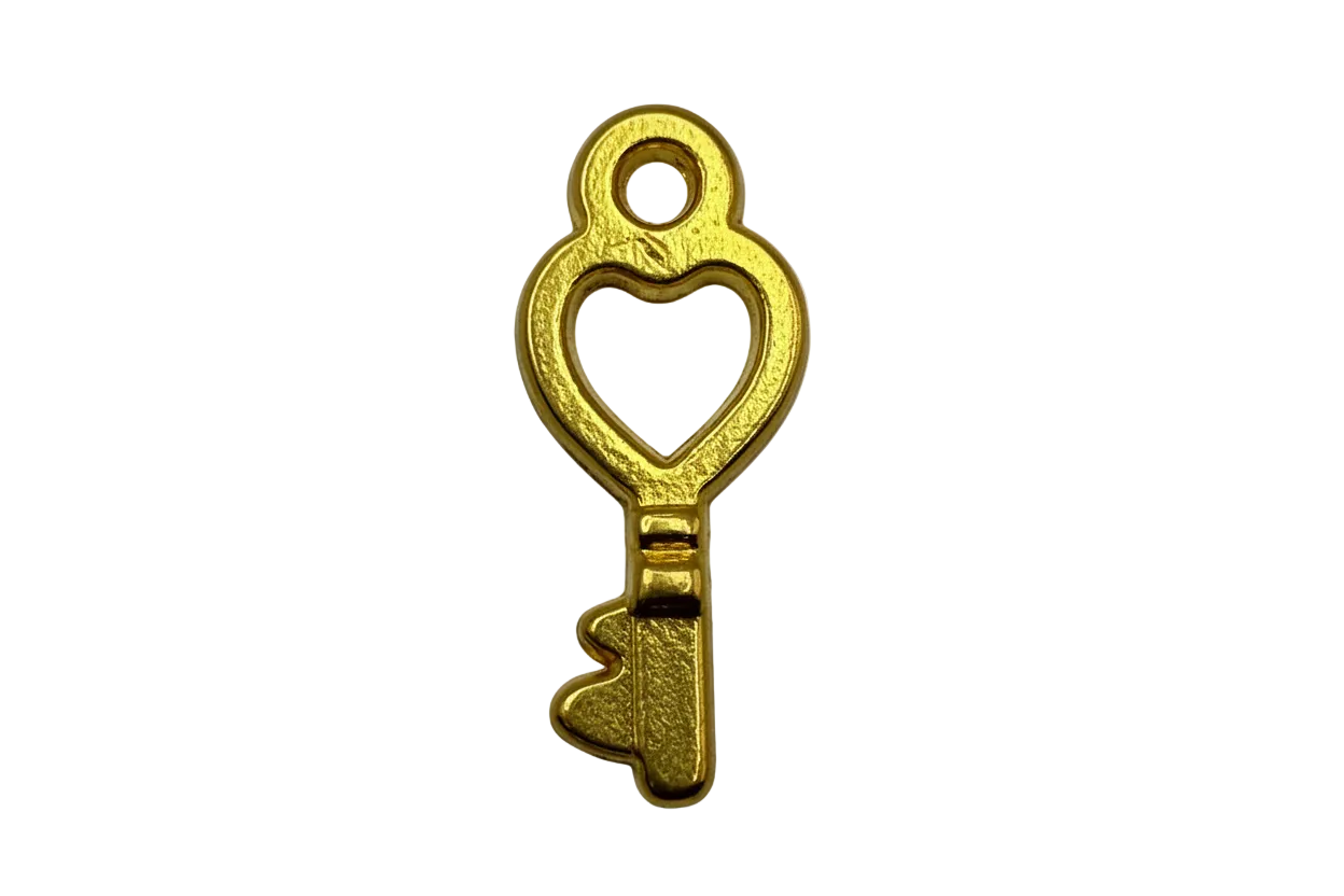 Gold heart cutout key charm with textured finish