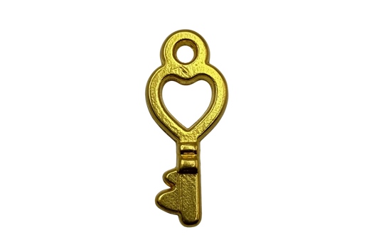 Gold heart cutout key charm with textured finish