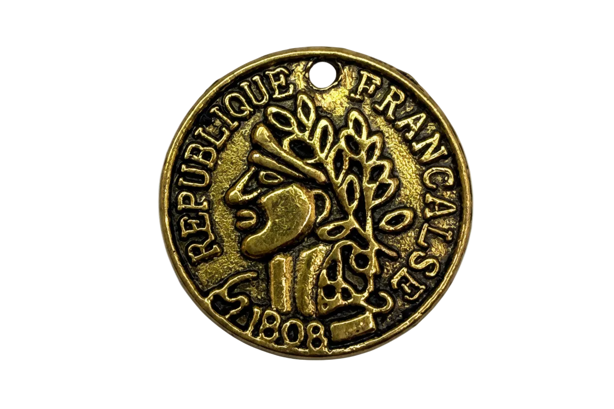 Antiqued gold coin medallion with raised emblem and French inscription, round disc design