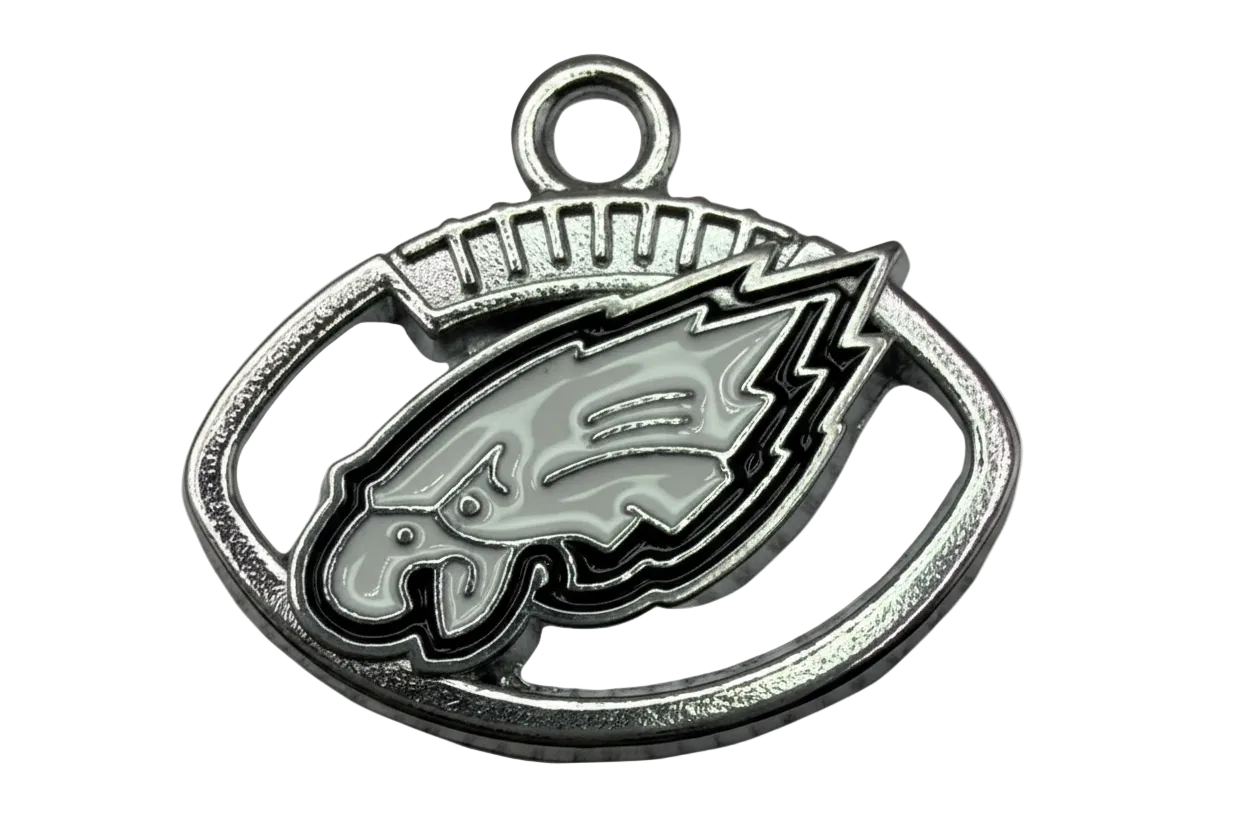 Silver oval emblem with gray enamel bird head and black outline detailing
