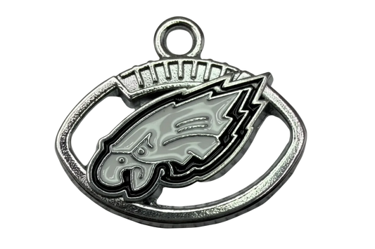 Silver oval emblem with gray enamel bird head and black outline detailing