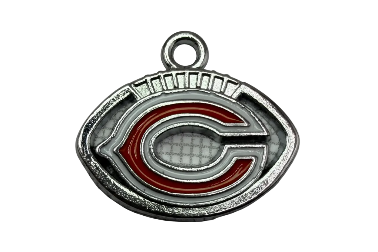 Silver-toned football charm with red and white enamel initial C design