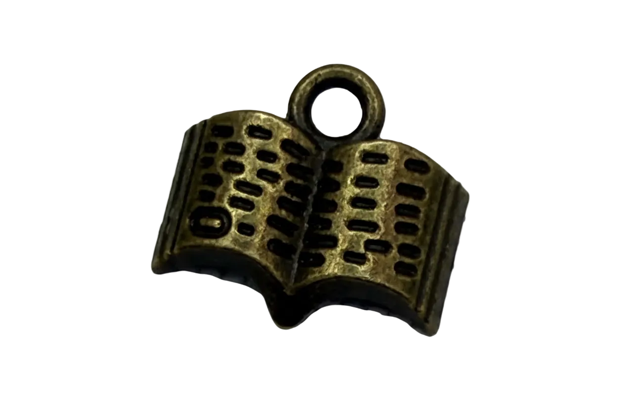 Antique gold open book charm with dark recessed details and textured pages