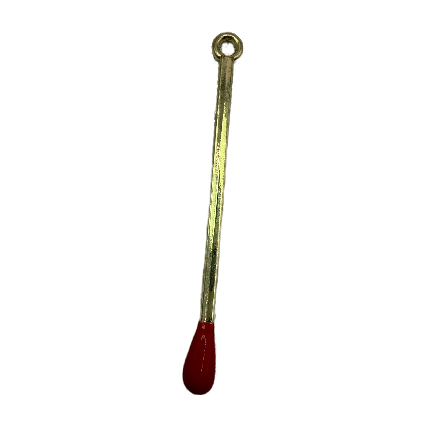 Polished gold matchstick charm with glossy red tip on black background