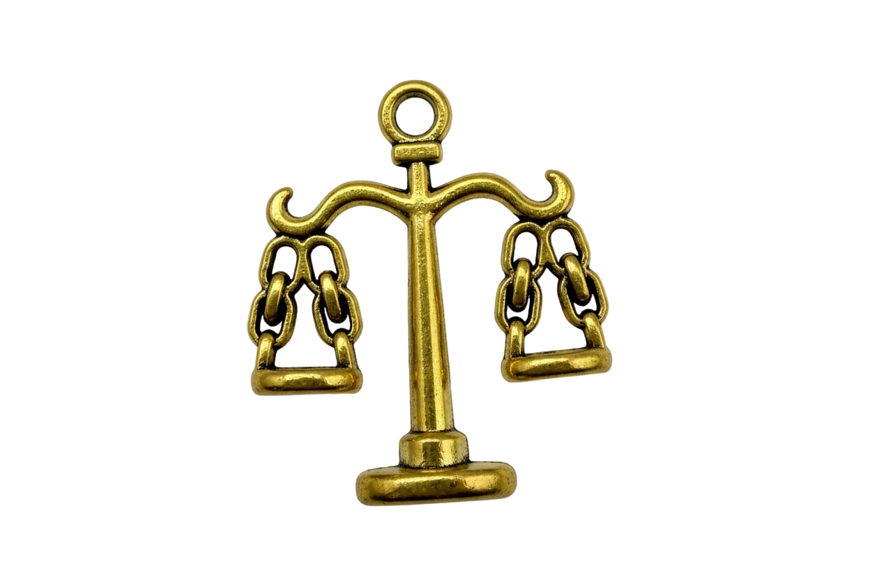 Gold balance scale with two hanging pans and subtle antique-style shading on a black background