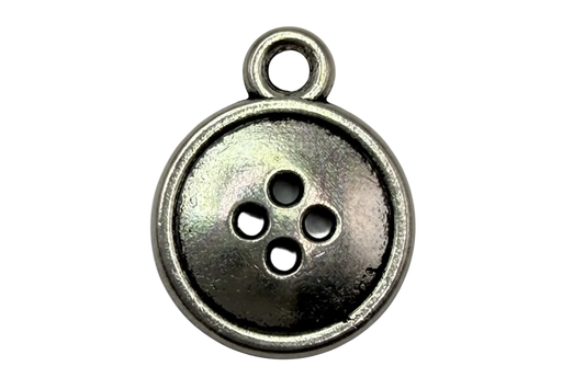 Antique silver button disc with four holes and a rounded rim