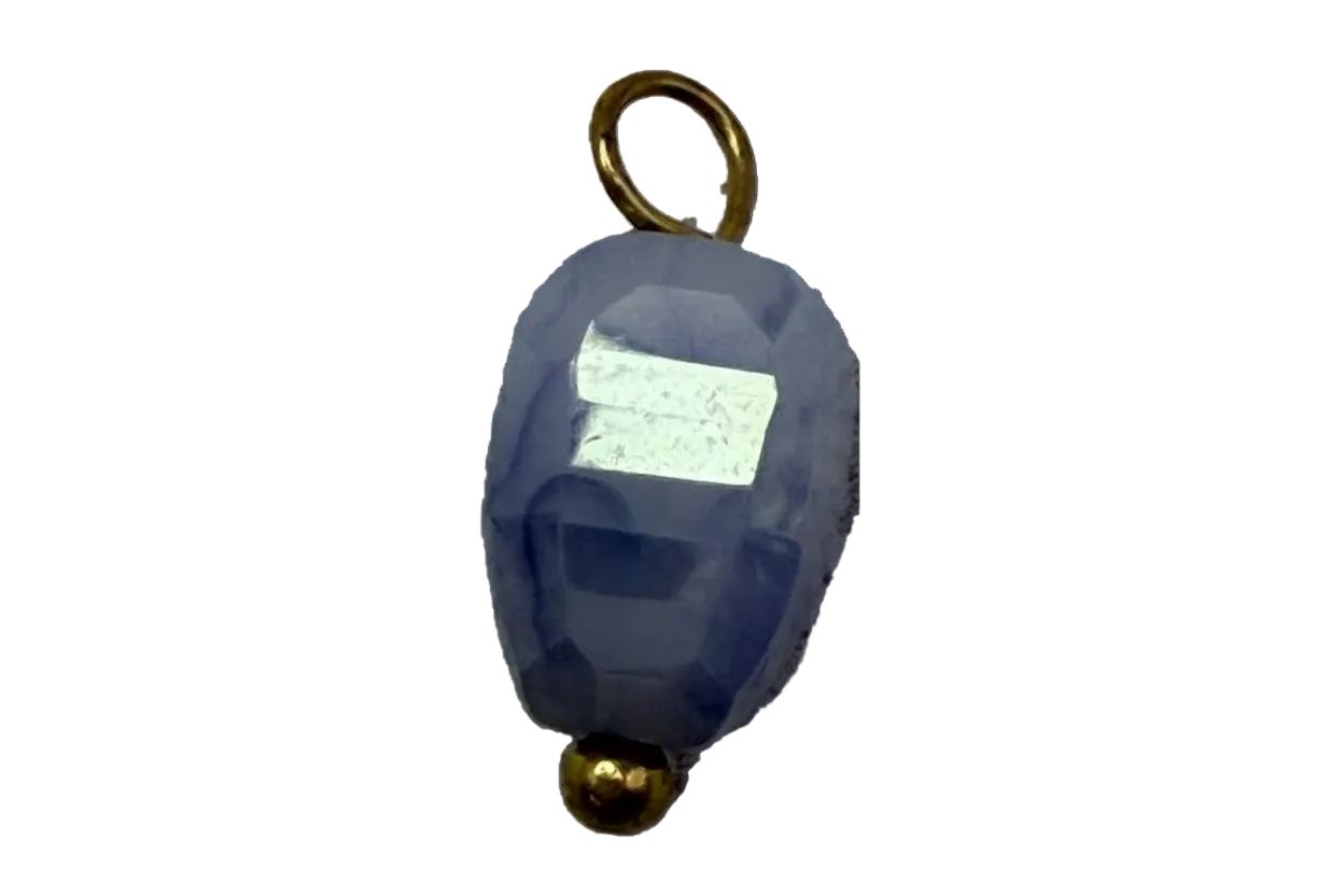 Faceted midnight blue oval gem charm with gold accents