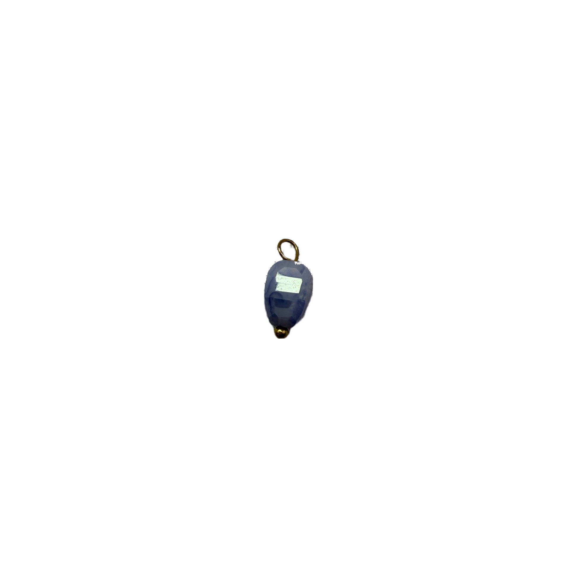 Faceted midnight blue oval gem with gold accents