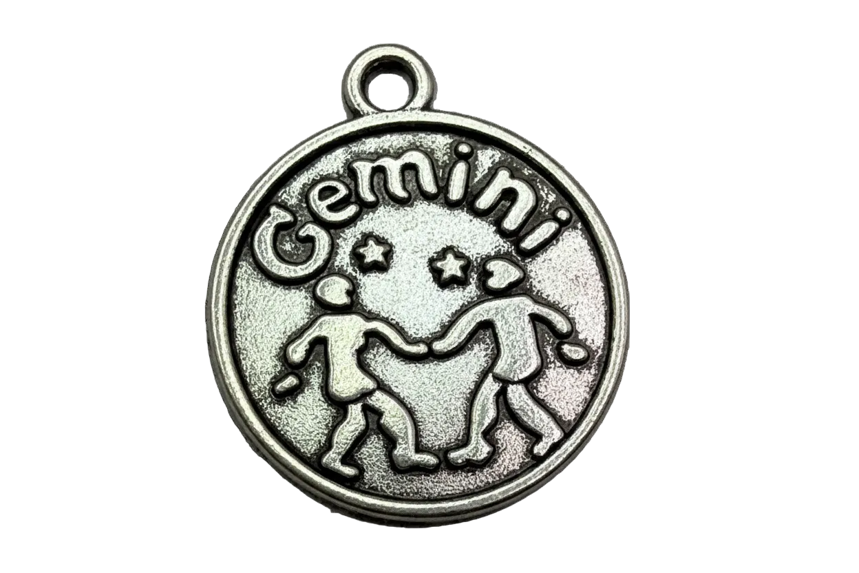 Antiqued silver Gemini zodiac round medallion with raised twins and Gemini lettering