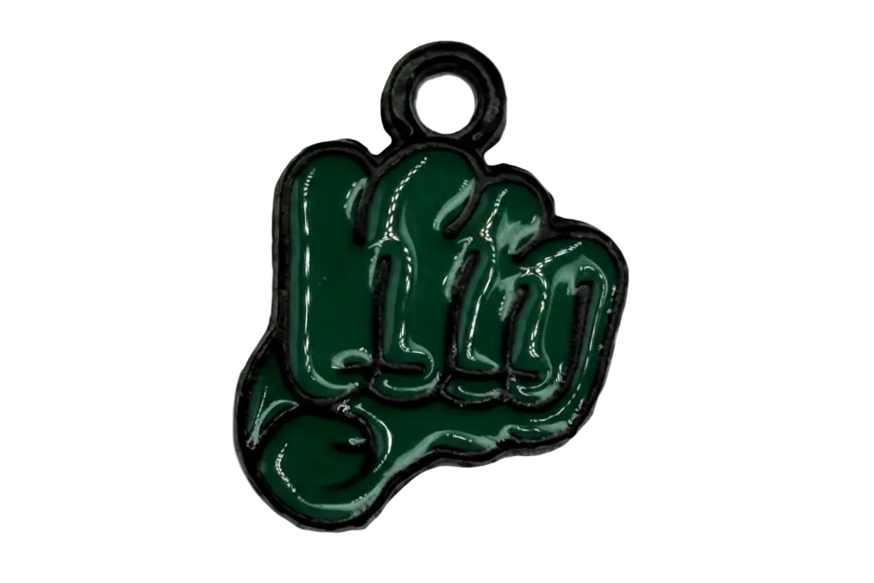 Glossy deep green raised fist enamel piece with dark outline and silver-tone top