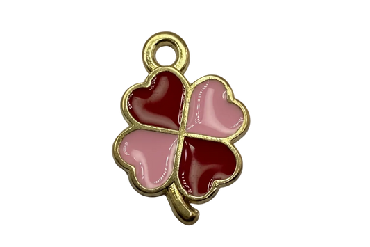 Gold four-leaf clover charm with heart-shaped petals in red and pink glossy enamel