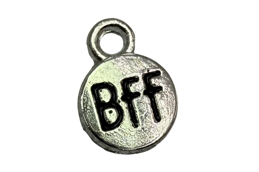 Round silver-toned coin with black BFF lettering and textured finish