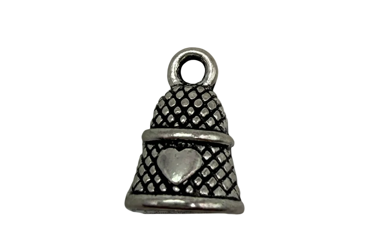 Antiqued silver thimble with raised heart and textured pattern