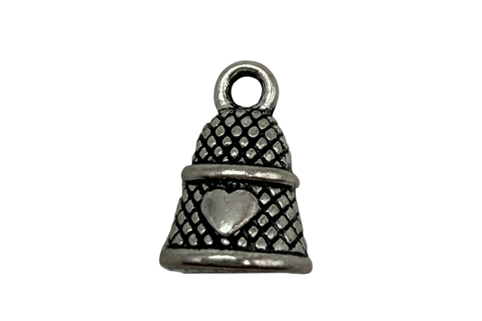 Antiqued silver thimble with raised heart and textured pattern