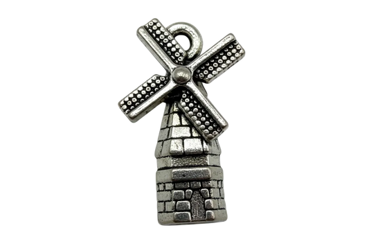 Antique silver windmill tower charm with textured brick base and dotted blades