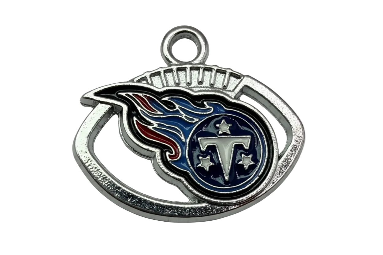Silver-tone enamel emblem with navy flame design, letter T, and star details
