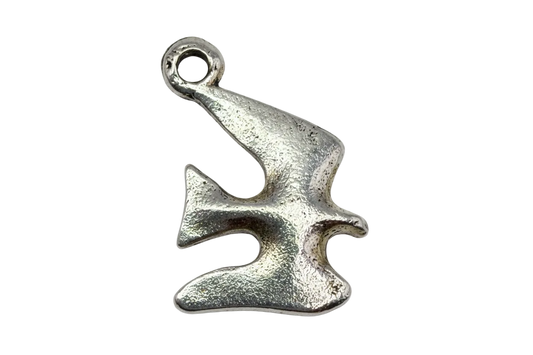 Textured silver jigsaw puzzle piece with a softly worn finish