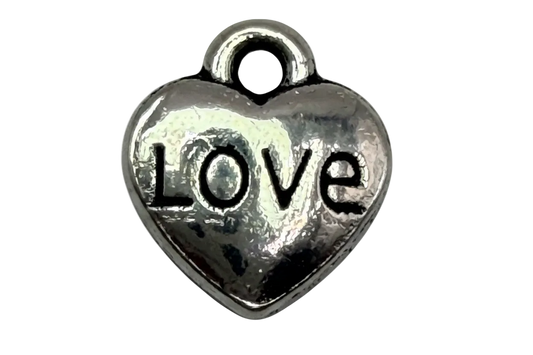 Polished silver heart with black “LOVE” lettering