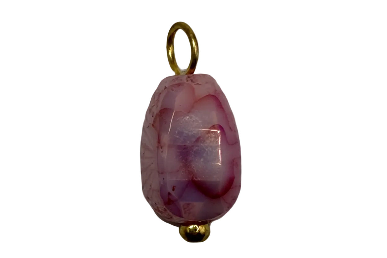 Faceted rose pink oval gem with translucent lilac tones and gold details