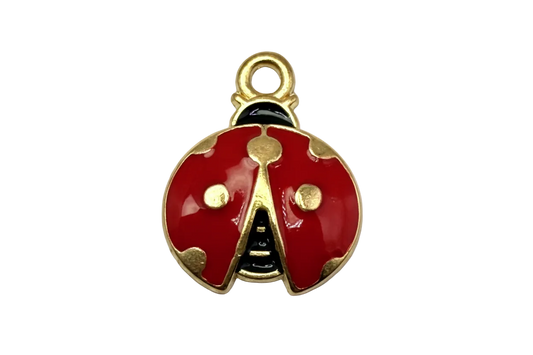 Glossy red ladybug charm with gold detailing, black accents, and a small clear gem