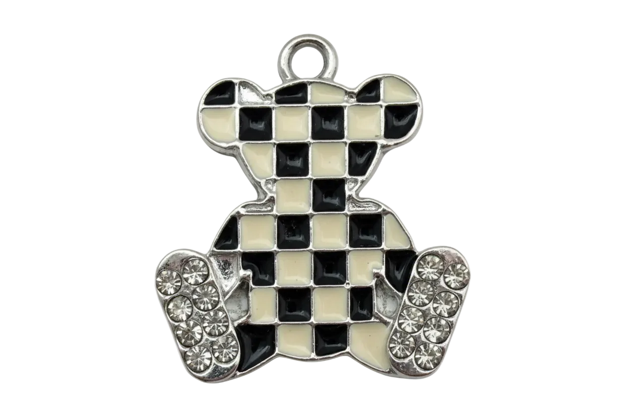 Silver teddy bear charm with black and white checkerboard enamel and clear crystal accents