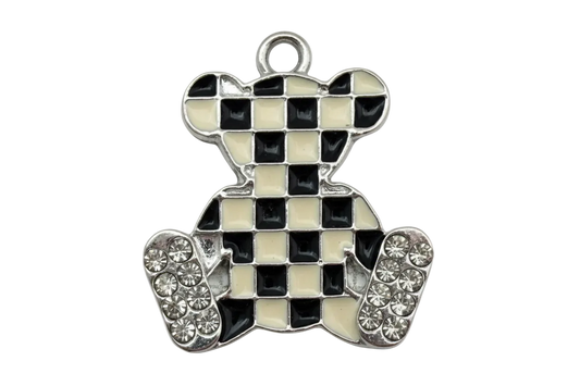 Silver teddy bear charm with black and white checkerboard enamel and clear crystal accents