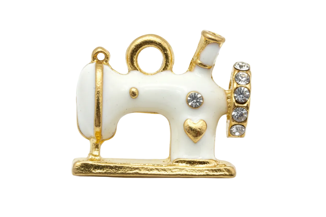 White and gold sewing machine charm with clear crystals and small heart detail