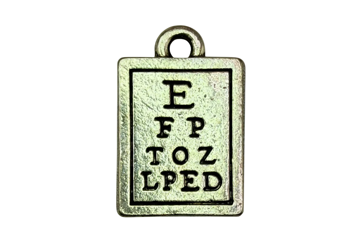 Antiqued silver rectangular eye chart tag with engraved letters and darkened outline