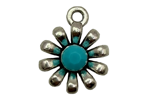 Silver sunburst flower charm with turquoise center and turquoise accents