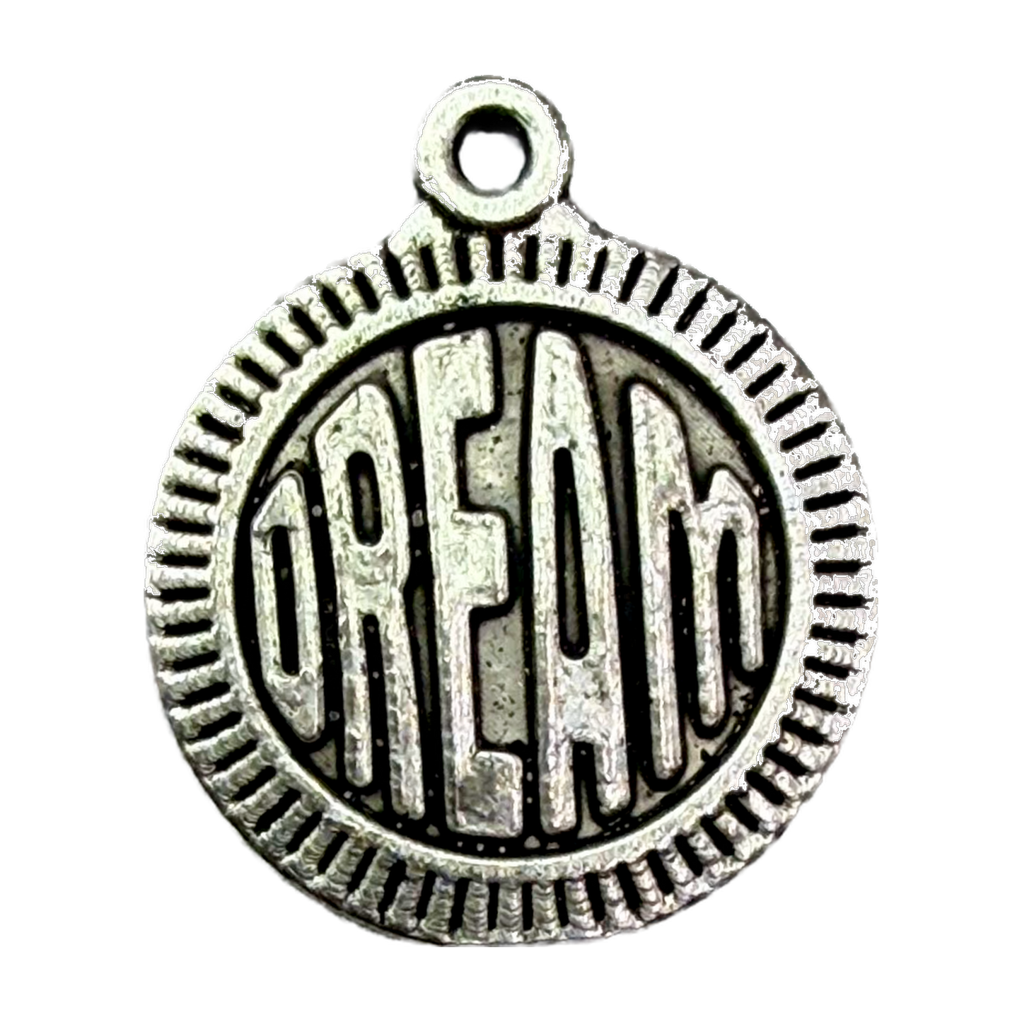 Antiqued silver round coin with raised DREAM lettering and ridged border