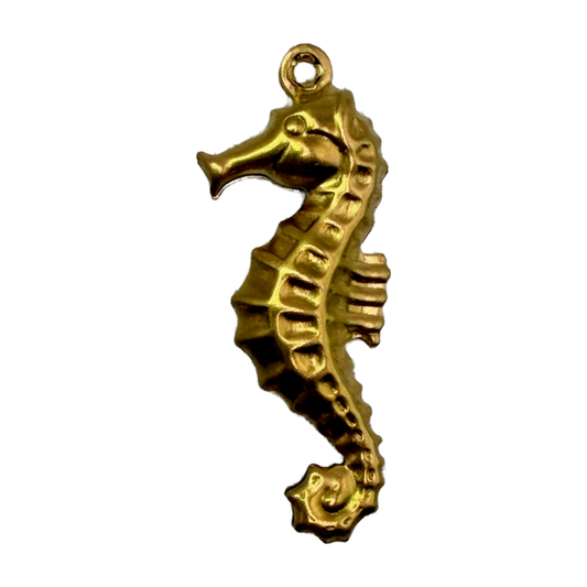 Gold seahorse charm with sculpted ridged texture and polished finish