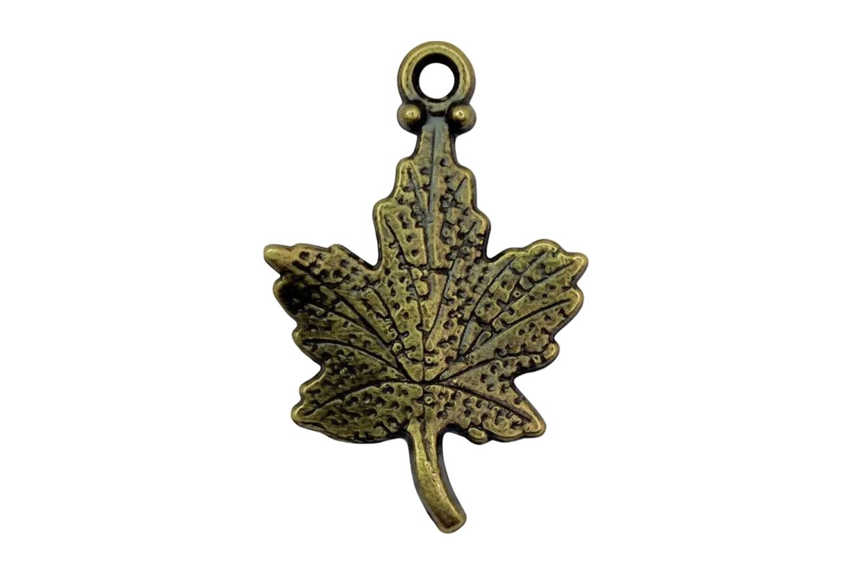 Antique gold cannabis leaf charm with textured, darkened detailing on black background