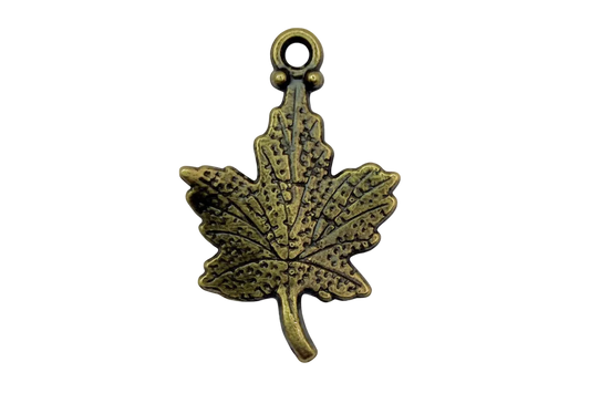 Antique gold cannabis leaf charm with textured, darkened detailing on black background