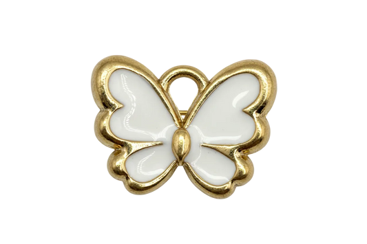 Glossy white enamel butterfly with gold outline on black background