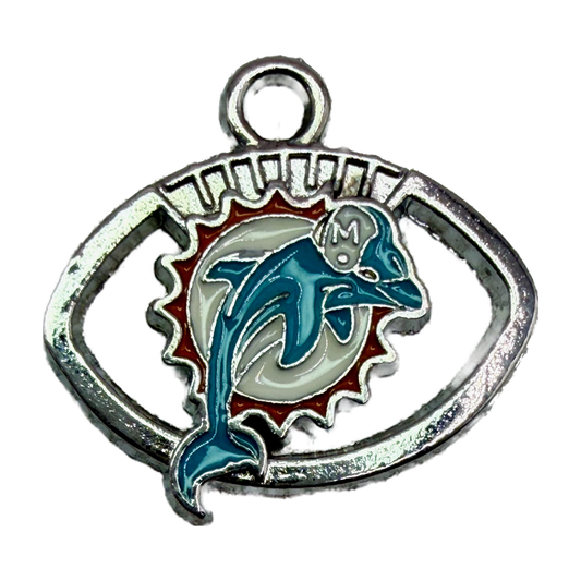 Silver football emblem with teal dolphin and white sunburst enamel accents