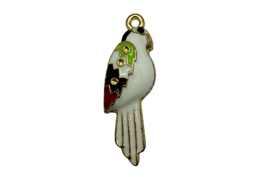 White enamel parrot with green, black, and red wing accents outlined in gold