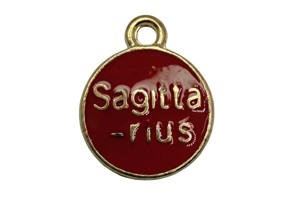 Round deep-red enamel Sagittarius coin with raised gold lettering and gold rim
